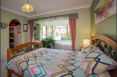 "Cozy Bedroom with Garden View – Karayadari Solutions"